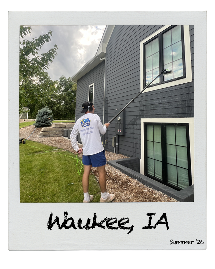 Smarter Shine Co. crew cleaning windows in Waukee, Iowa